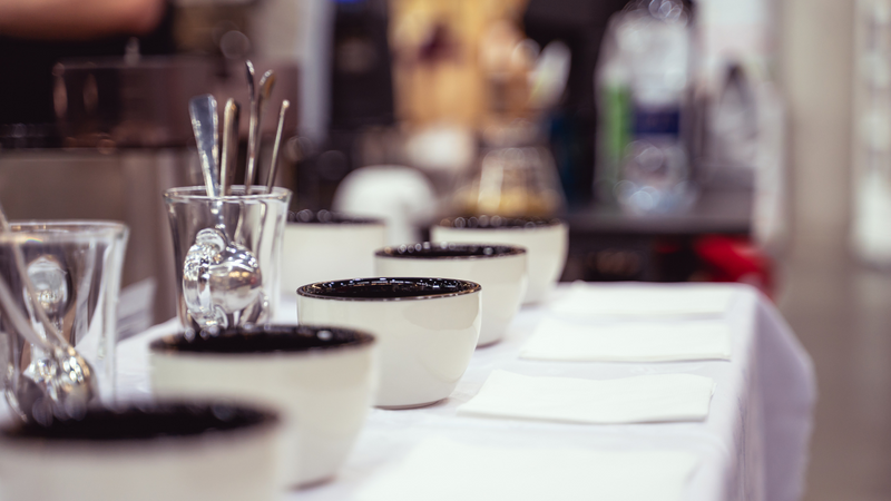 Cupping bowls and spoons on a cupping table